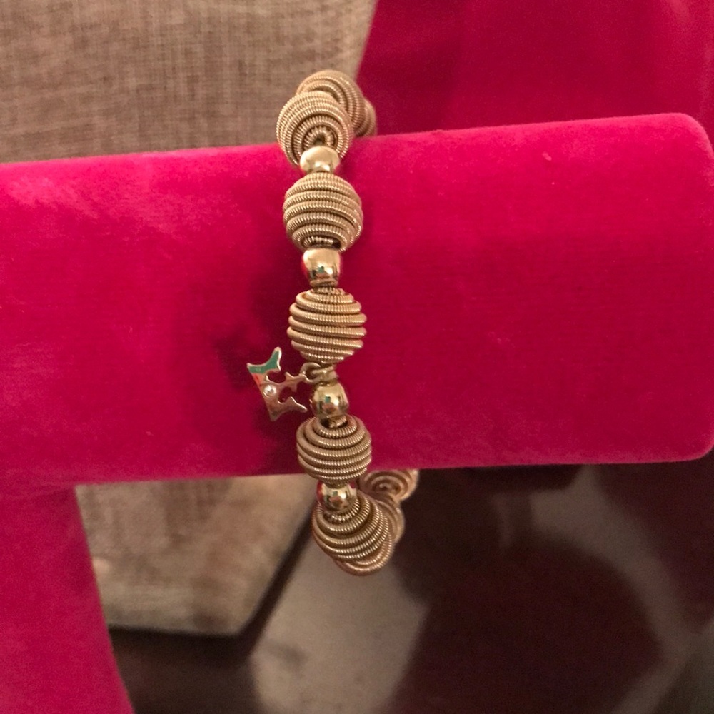 Gold tone stretch bracelet with crown and rhinestone. Well made
